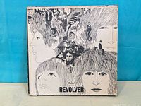 Front cover showing Revolver artwork