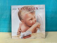 Front album cover showing cherub artwork and title