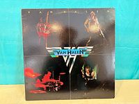 Front jacket with Van Halen wing logo and band images