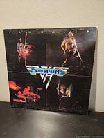 Front cover with four band photos and Van Halen logo