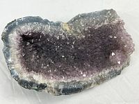 Front view showing full amethyst crystal face and agate rim