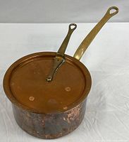 Saucepan with lid in place, showing handles