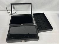 Two glass-lid velvet-lined display cases and one matching partitioned tray