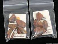 Two resealable bags each containing rough Poppy Jasper stones