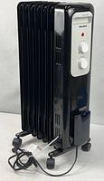 Full view of Pelonis oil-filled radiant heater on casters