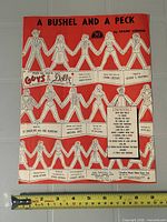 Front cover showing title, composer, Guys and Dolls reference, ruler for scale