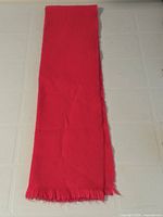 Scarf folded lengthwise showing full length and fringe