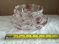 bowl nested in dish beside measuring tape showing diameter