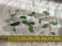 Group view of all sea glass pieces with ruler for scale