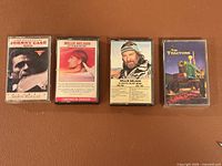 Group shot of all four cassette tapes in cases