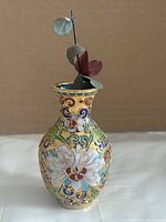 front view of cloisonné mini vase with metal flower