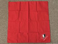 Full view of unfolded red napkin