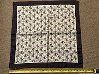 Full view of square tablecloth with measuring tape showing width