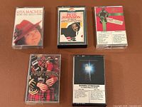 Group shot of all five cassette tapes in cases