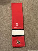 Full view of folded red Ottawa Senators scarf