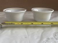 Side view of both bowls with tape for height reference