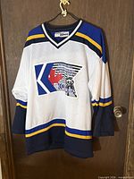 Full front view of white Kobe mesh hockey jersey with stripes