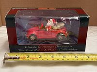 Boxed ornament front view showing vehicle and packaging text