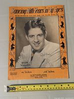 Front cover showing title, publisher, portrait and autograph