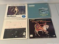 Front jackets of all four LPs