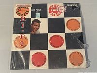 Front album jacket showing title, artist, cover art, price sticker, partial shrink