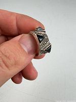 Front view showing black triangular stones and marcasite detailing