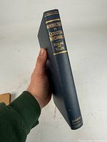 Spine showing title, authors, publisher