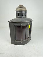 Front view showing red glass lens and protective rods