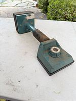 Overall view of the carpet knee kicker showing body, dial and kneepad