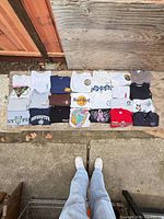 All 23 shirts laid out on ground