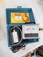 Analyzer meter, manual, probe, wiring inside carrying case