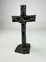 Full view of freestanding cast metal crucifix