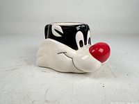 Front view of Sylvester head mug showing facial details and handle