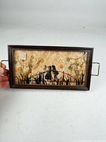 Front view of framed pressed flower tray showing entire design and handles