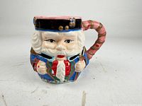 Front view of figural Nutcracker mug