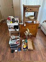 Overview of furniture pieces, decor, cart and supplies