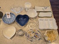 All 14 bowls, dishes and trays arranged on countertop