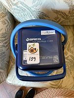 Top view of Breg Polar Care Cube showing logo, handle and hose