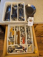 Drawer with complete Cambridge flatware set and mixed utensils