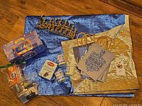 Group shot showing menorah, candle boxes, votives, gift bags and wrap