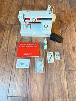 Overall view of sewing machine and all accessories