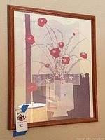 Full view of framed floral print on wall