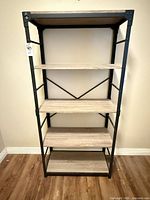 Front view of five-shelf metal and wood bookcase