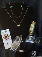 Group shot showing all jewellery pieces on display stands