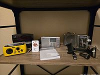 Shelf view showing all radios, phone mount components and car chargers