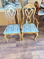 Both chairs front view showing design and upholstery