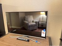 Front view of Samsung TV on stand