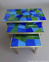 Top view of three nesting tables showing stained mosaic glass pattern
