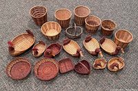 Group shot of all 20 wicker baskets arranged on carpet
