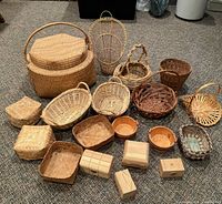 Group shot of all 17 woven baskets and wooden boxes